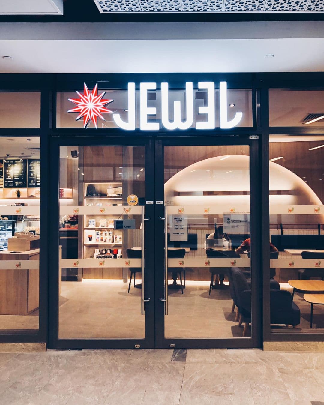 Jewel Coffee – Calm and Elegant Study Spot in Singapore Front door view of Jewel Coffee with sparkling logo and peaceful study environment inside