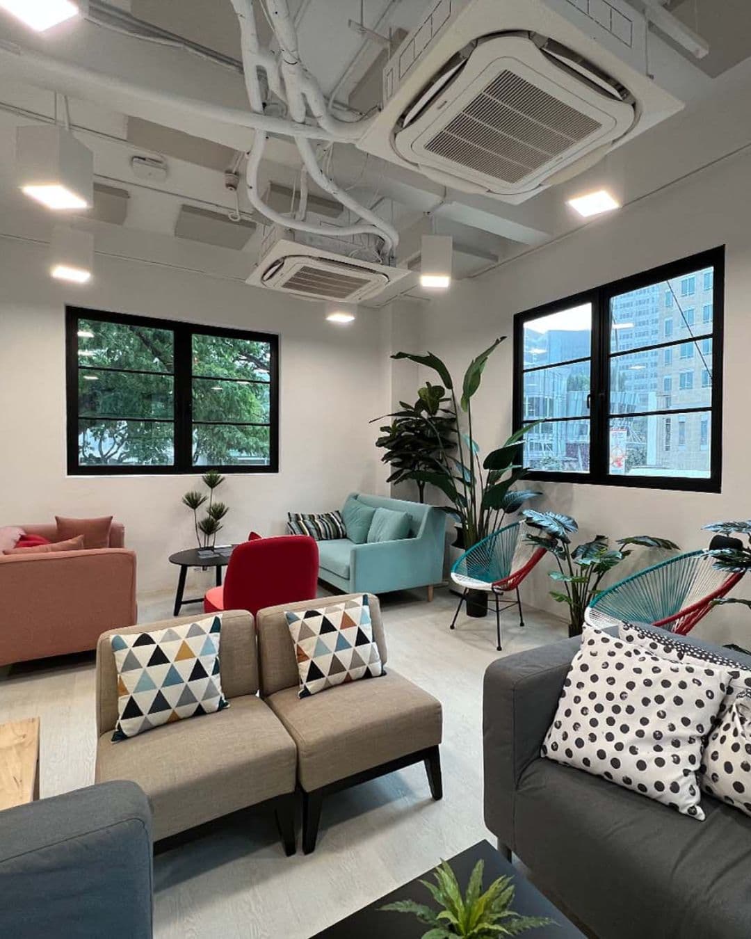 The Red Box – Youthful & Motivational Study Environment Colorful indoor space at The Red Box with city and green views through windows
