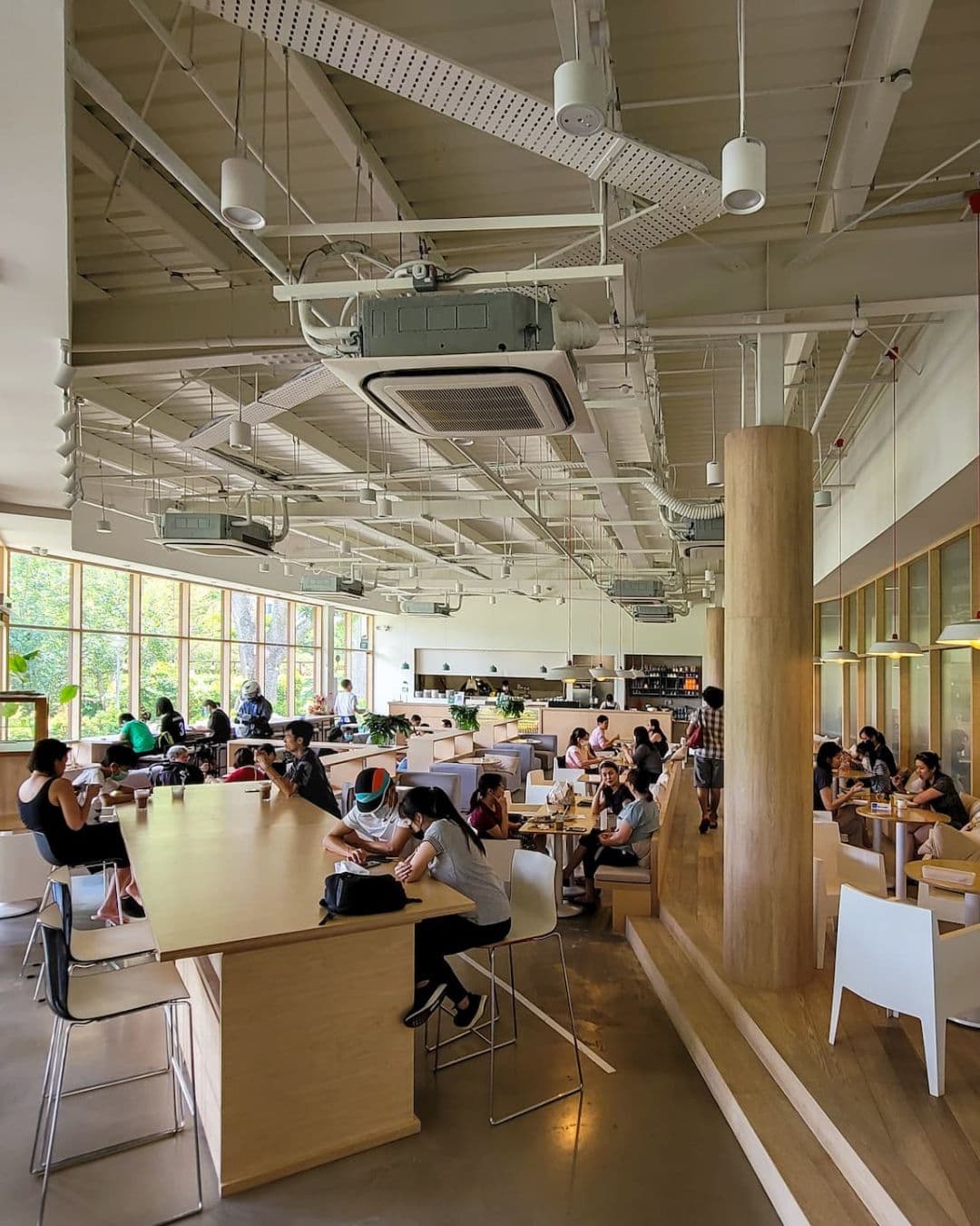 Tzu Chi Youth Centre – Versatile Study Hub with Natural Light Spacious youth center with varied study desks, seating areas, and green views